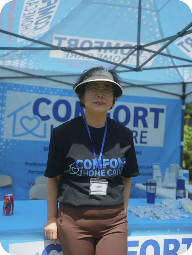 Comfort Home Care Team Member at Community Outreach Event | Comfort Home Care Comfort Home Care team member representing the agency at a community outreach event booth